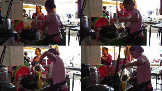 泰国曼谷美功铁路市场商贩榨果汁