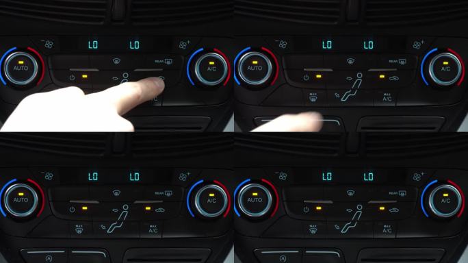 手指按下按钮，打开乘客舱空气再循环模式，车内两相气候控制