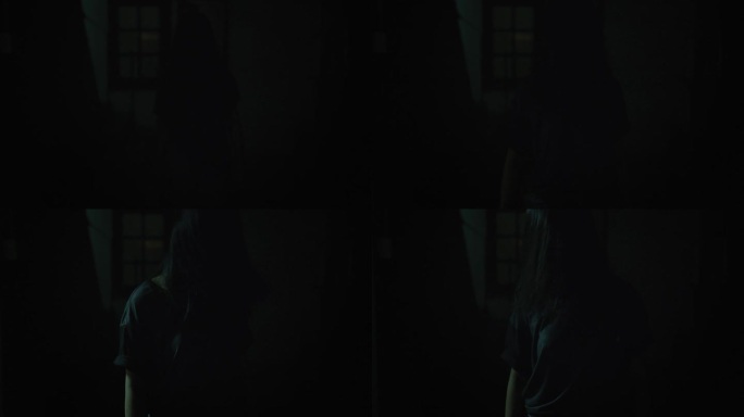 恐怖场景一个神秘可怕的亚洲鬼女人令人毛骨悚然的有头发遮住脸走到相机在废弃的房子与黑暗的场景电影在晚上
