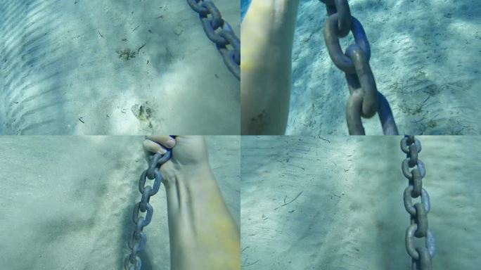 POV潜水员在海中拖着一条链子