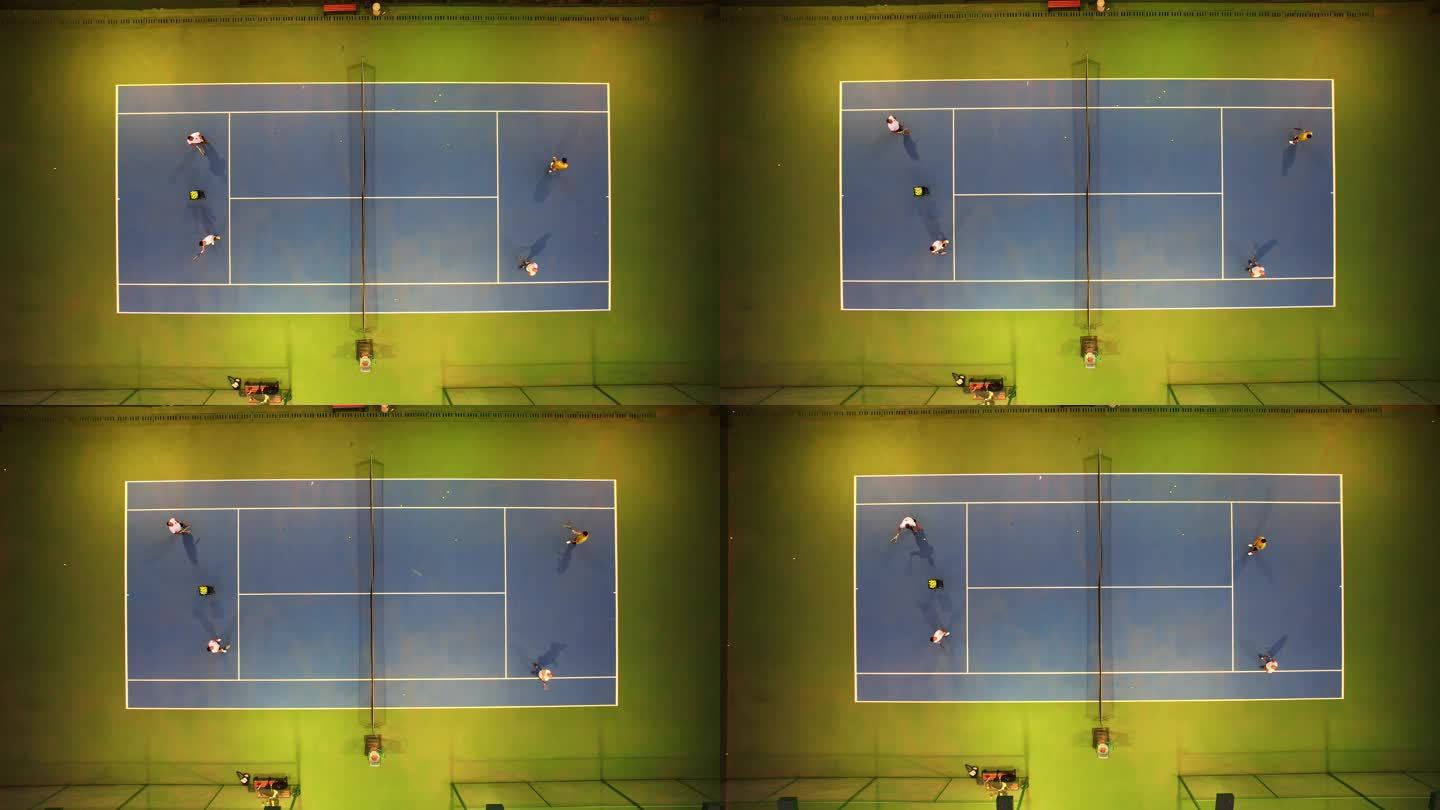 航拍城市校园灯光网球场运动健身打网球的人
