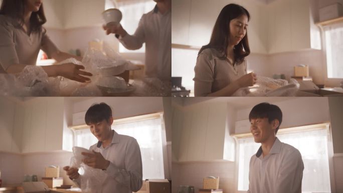 幸福的房主搬进来:可爱的韩国夫妇在他们舒适的新公寓里打开盒子和厨房用具。抵押贷款，房地产，二口之家甜