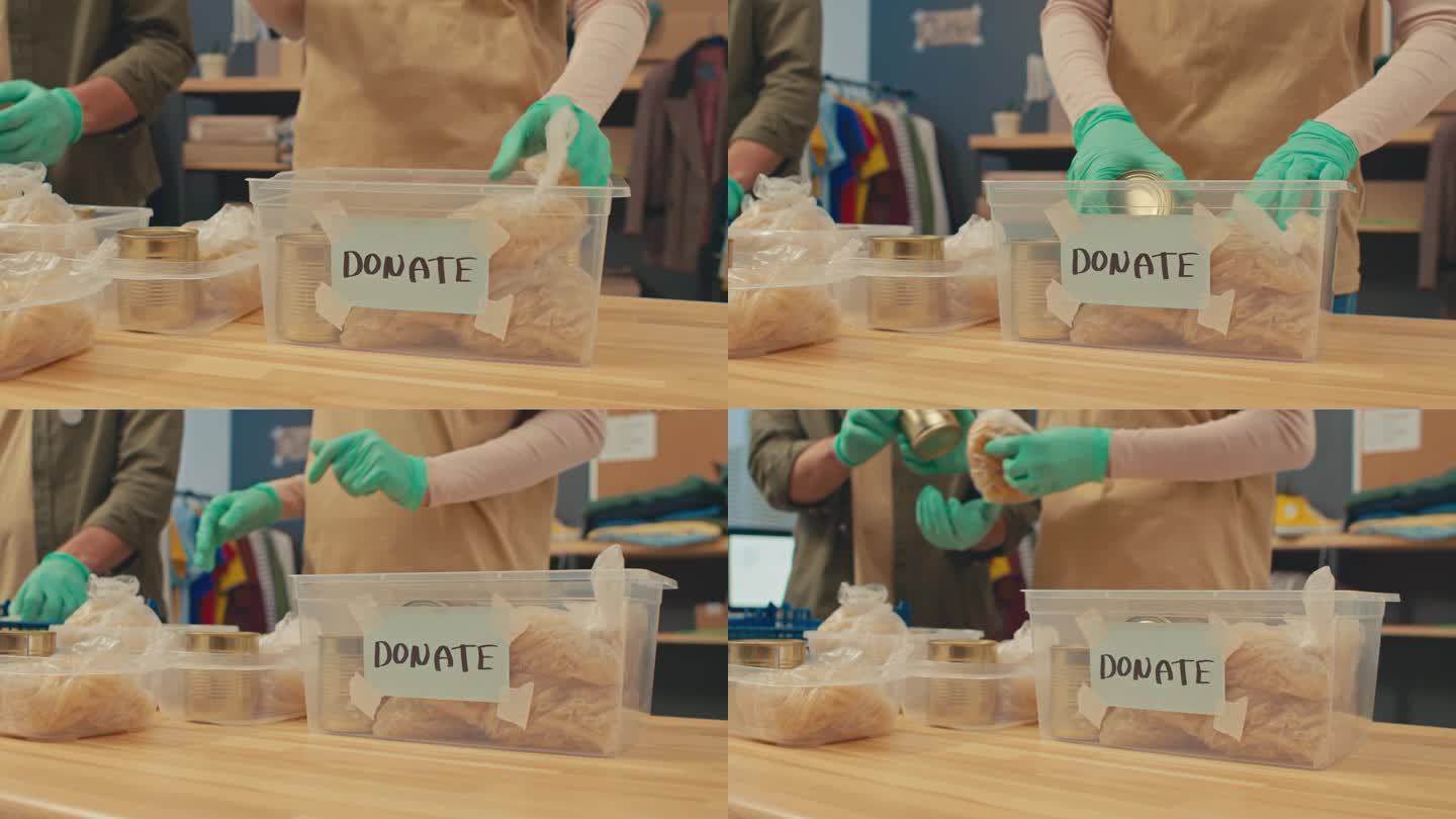 慈善项目协调人将食物放入捐款箱