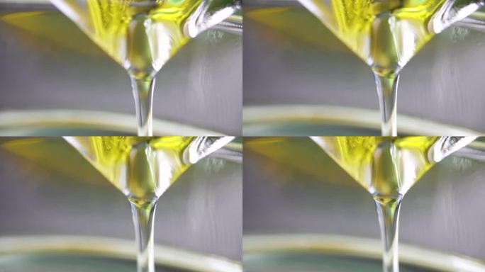 透明透明的黄色油倒入玻璃4k电影