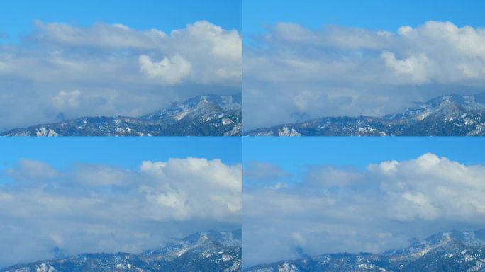 雪山前云反流。云中的山顶。间隔拍摄。