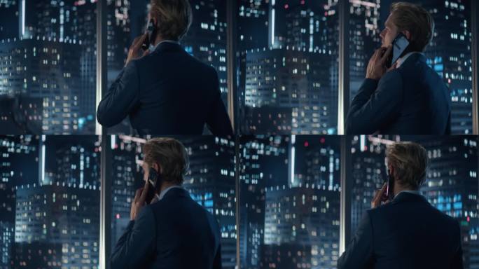 深夜，穿着时髦西装站在摩天大楼林立的大城市办公室窗边的英俊白人商人的后景。男性CEO与合作伙伴在智能