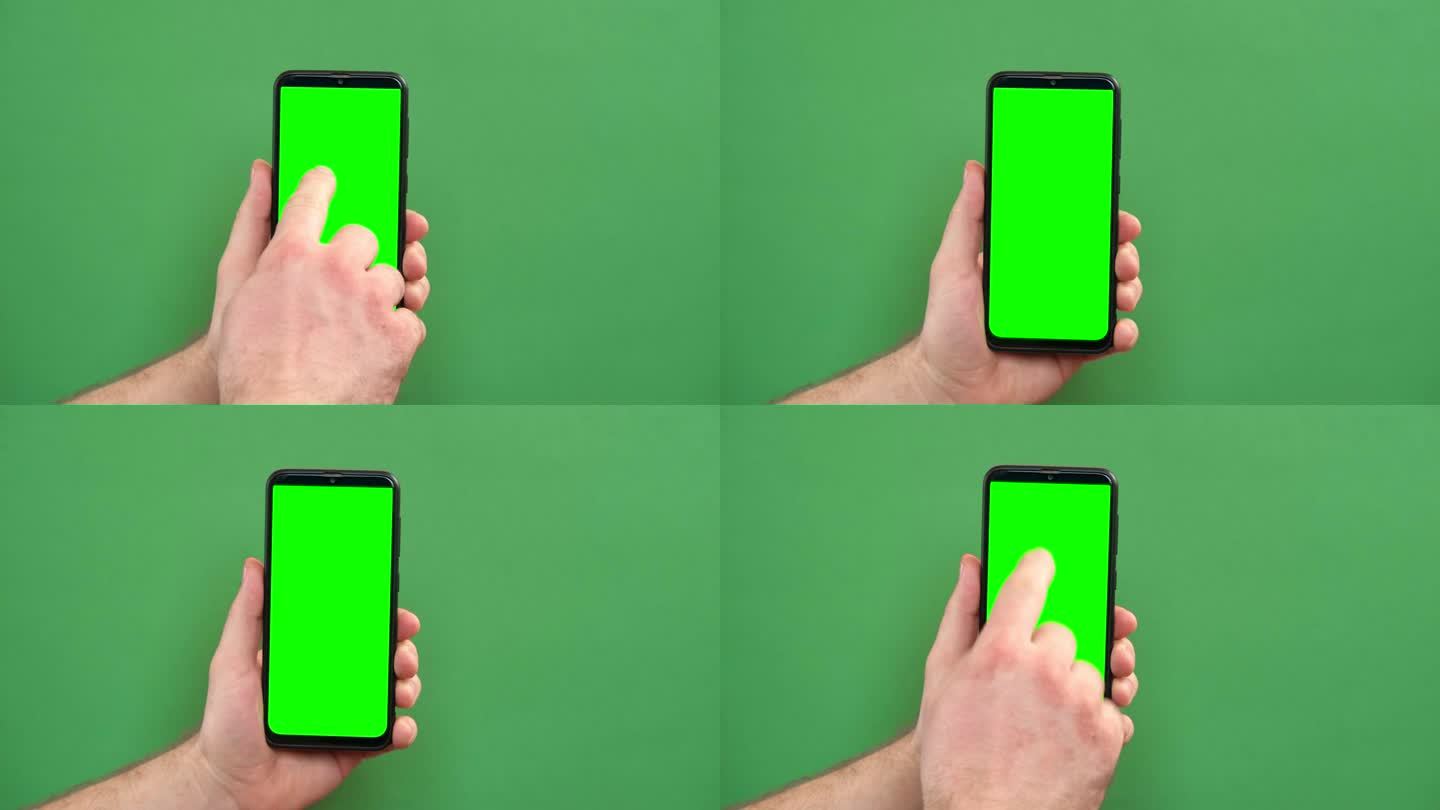年轻人手持绿色背景的绿屏智能手机。手势。男性用手触摸，点击，敲击，滑动黑色手机的彩色显示屏。关闭设备