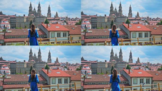 一个旅游女孩看着圣地亚哥德孔波斯特拉大教堂，俯瞰西班牙的城市全景。