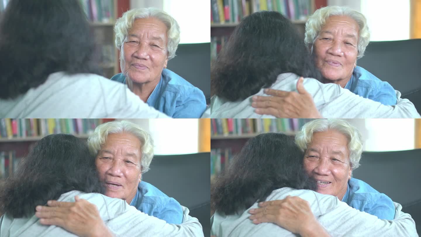 亚洲奶奶和孙女拥抱，以表达他们对彼此的爱和关心。