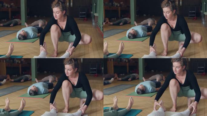 禅，脚和一个女瑜伽教练在课堂上与一群人的健康或保健。运动，训练和健身锻炼与一个年轻的瑜伽师教一节课的