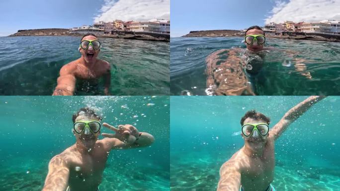 一个年轻的漂亮的活跃的男人游泳和享受户外假期在海上浮潜寻找鱼和珊瑚。男性旅行者拿着相机在蓝色的海洋里