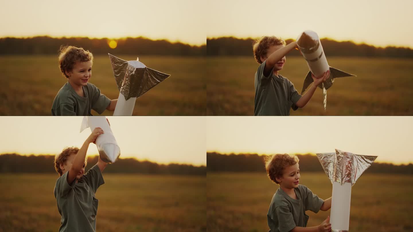 快乐的小男孩独自在大自然中玩耍，孩子拿着玩具火箭，想象太空旅行
