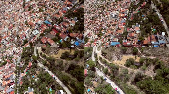 电影动作空中无人机拍摄的巴塞罗那城市景观与街景和车辆运行的道路和通信塔。