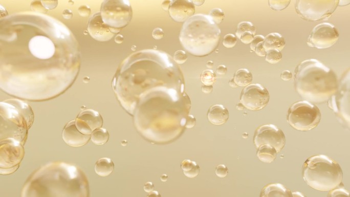 微距镜头的各种黄金泡沫在水上升在浅色背景。