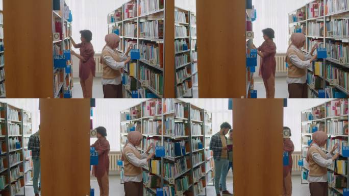 多民族学生在图书馆书架上找书