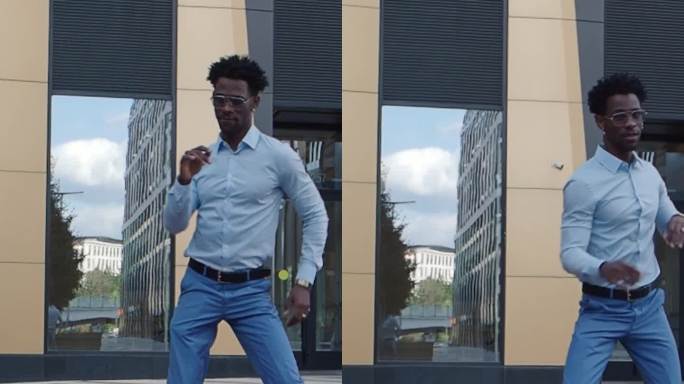 一个非裔美国人在城市街道上跳舞。帅气的黑人男模特在户外