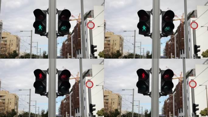 城市道路信号灯从绿到红闪烁。行人及单车安全