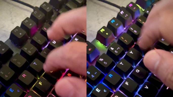 手按游戏电脑键盘的特写，背光黑键变色，人的手敲击键盘，RGB光，4k，垂直