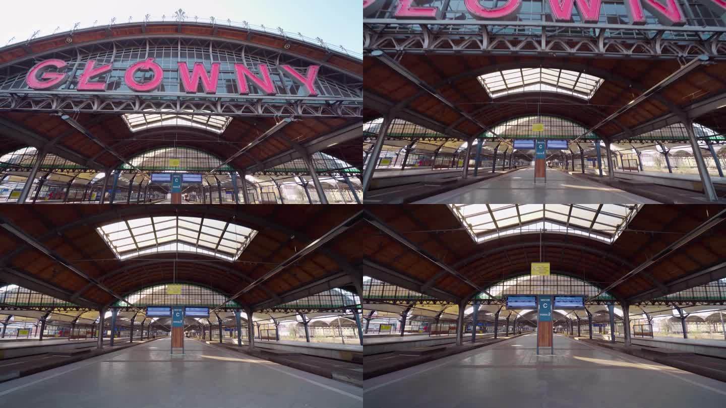 波兰Wrocław的主站PKP Wrocław Główny。4K万向节镜头。站台，楼梯，入口，霓虹