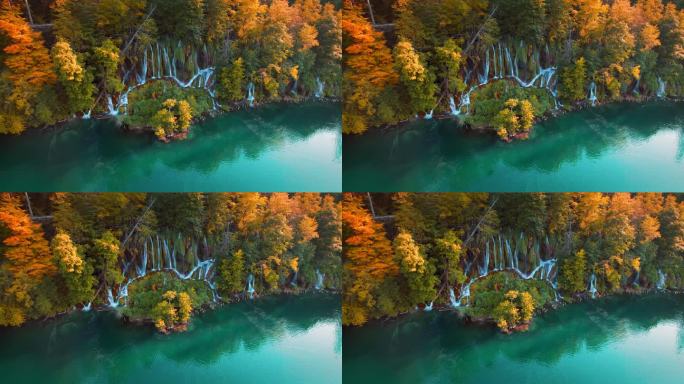 瀑布在色彩缤纷的秋天森林和山湖与清澈的蓝绿色的水在日落。长着黄叶的树。原始的本性。