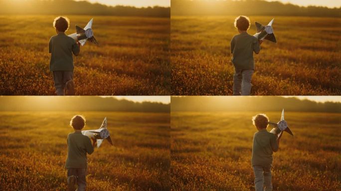 暑假里，小男孩在草地上玩手工火箭，小男孩梦想着太空