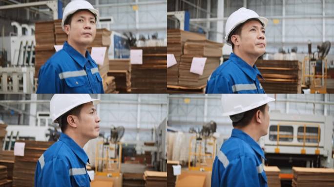 年轻的成年亚洲男性技术员工程师，仓库工人巡视工厂。制造业业务，工业工作，或人在工作的概念