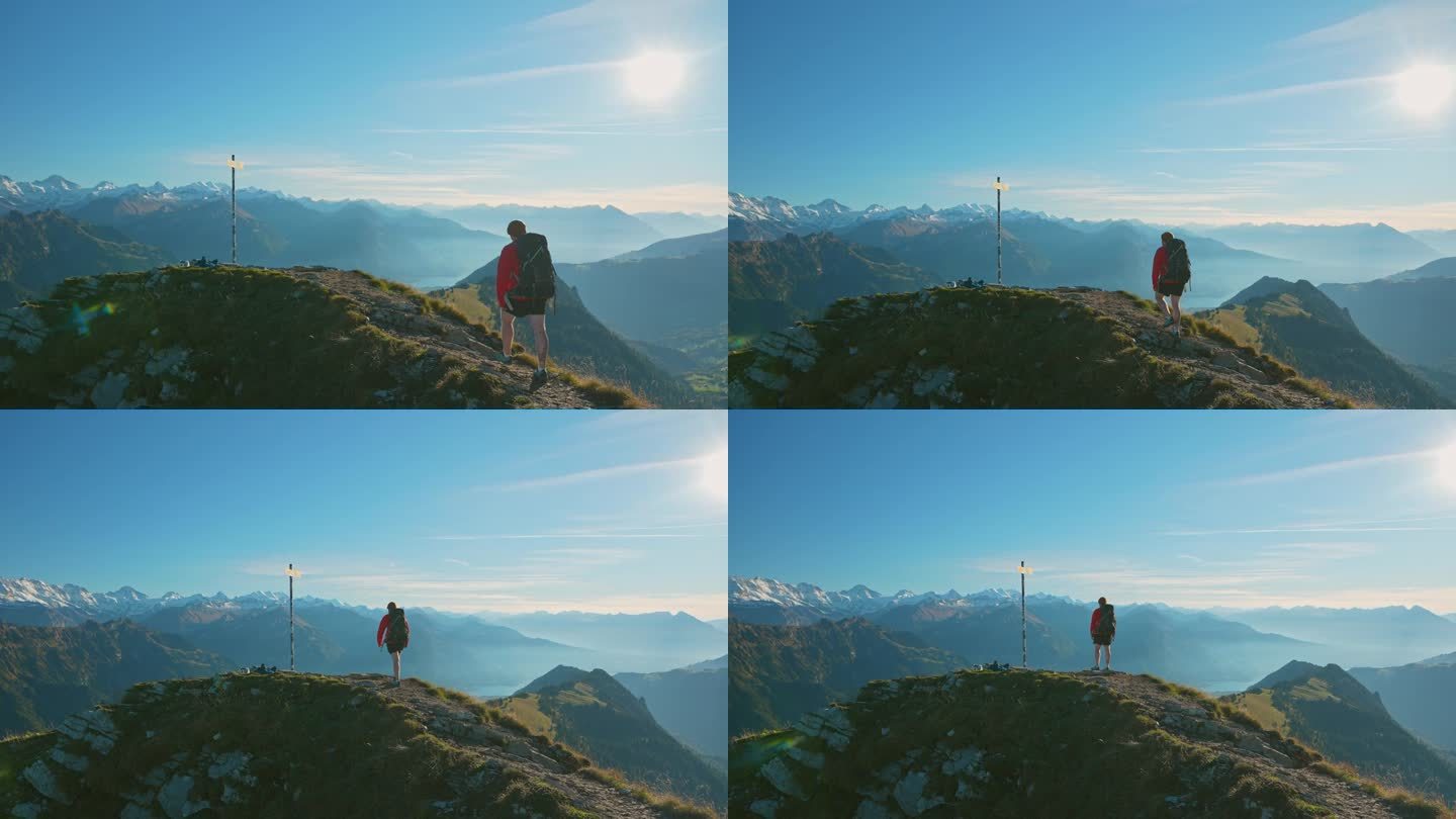 一名男子徒步旅行的背景在因特拉肯在瑞士阿尔卑斯山附近的路标