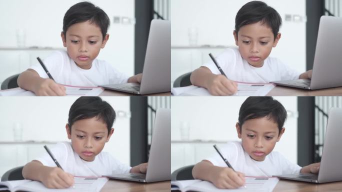 印尼小男孩在家做作业