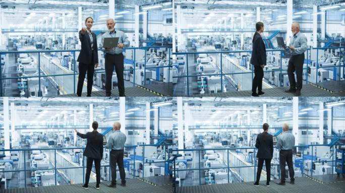 在一家配备人工智能机械臂的现代自动化电子制造工厂，男工程师和女项目经理站在平台上交谈，使用笔记本电脑