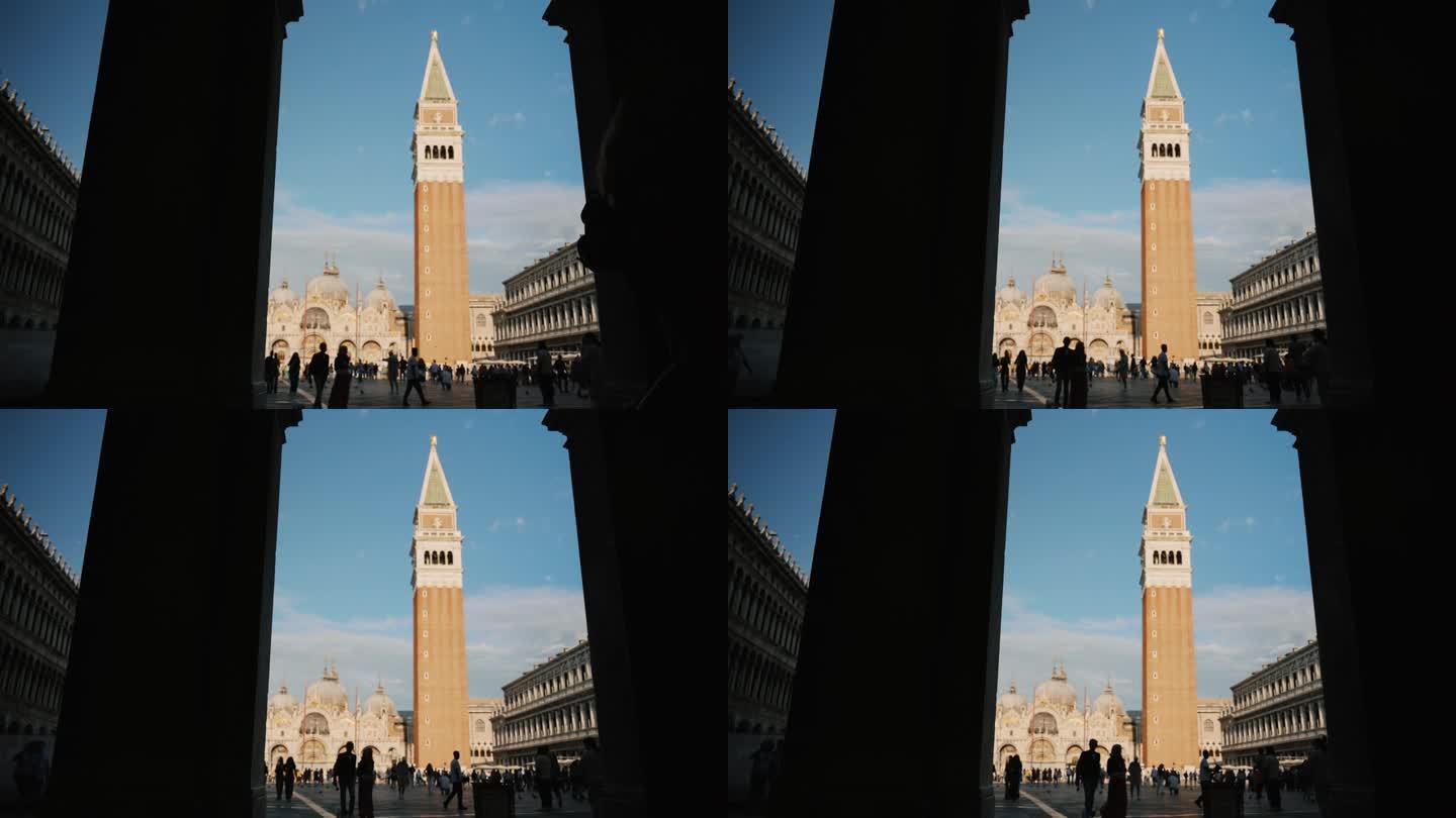 游客在威尼斯圣马可广场漫步，钟楼触摸蓝天