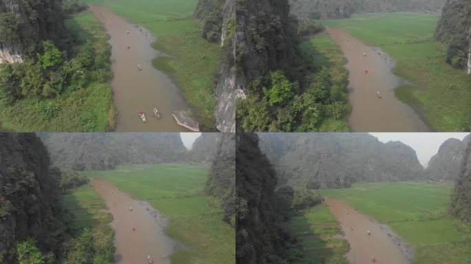 飞越越南宁平的河流，周围环绕着绿色的稻田