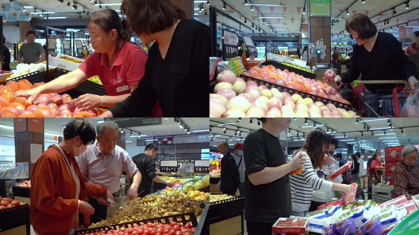 现代化大型超市水果专区挑选苹果龙眼