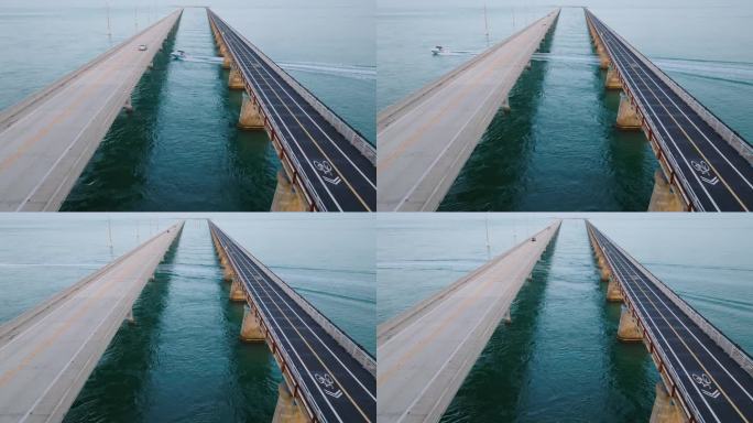 佛罗里达群岛七英里大桥的静态鸟瞰图，下面有快艇通过