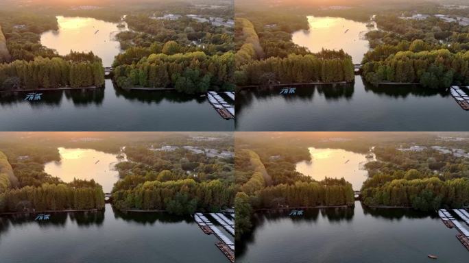 航拍夕阳下的中国杭州西湖杨公堤