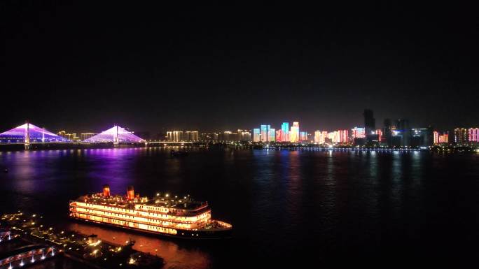 航拍武汉城市夜晚长江上航行的知音号游轮
