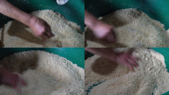 4K农村做玉米米酒放酵母搅拌实拍视频
