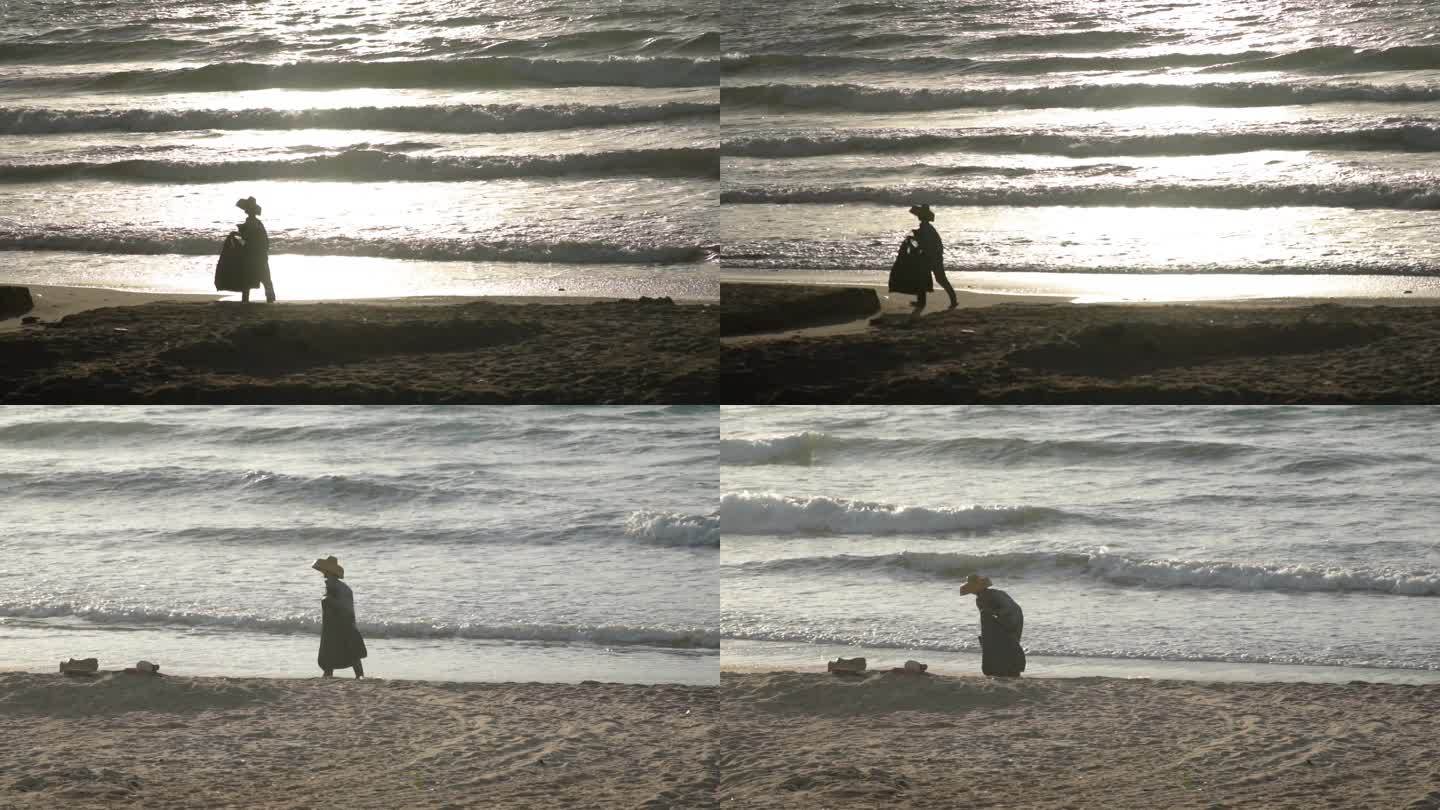 4K海边的老人拾荒老人海滩清洁工实拍视频