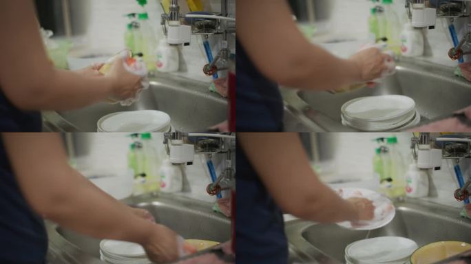 特写:女人洗碗的手