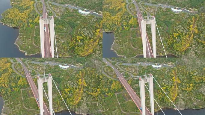 在瑞典的秋天，与过往的车辆一起飞越Hogakustenbron桥。无人机航拍