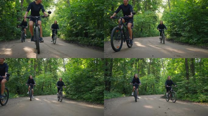 林地中的自行车比赛，大自然中骑自行车的美女，地面上自行车车轮的细节