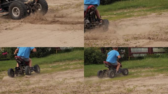 亚视车轮在急转弯时踢起尘土和沙子的特写。慢动作视频。一个孩子骑着一辆全地形车在沙滩上奔跑，扬起尘土。