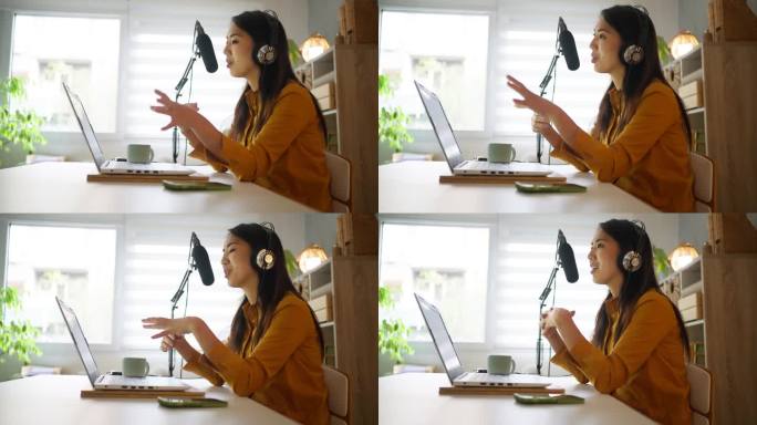 年轻的女播客日本裔，在她的家庭工作室录制播客