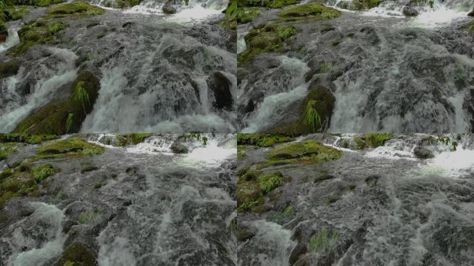 在西班牙的Río Parga, A Coruña，瀑布流在长满苔藓的岩石上的慢动作。