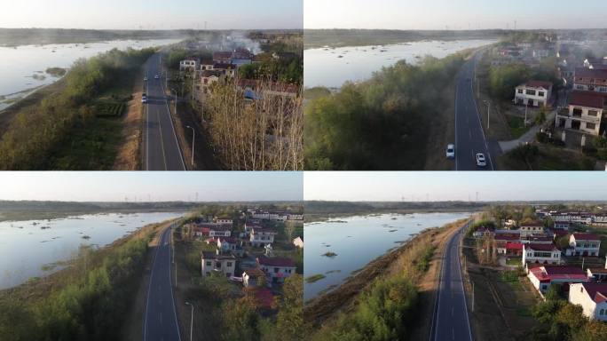 沿马路航拍淠河湿地公园附近的村庄