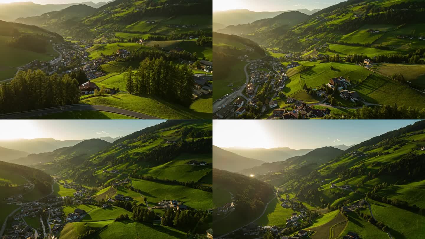 鸟瞰图:意大利东北部白云石山脉附近夏季日落时分的自然村庄和农场的超延时镜头。