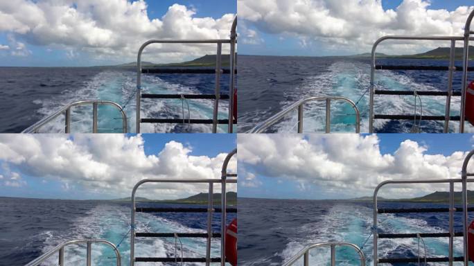 [关岛]驶离关岛海岸的快艇发出的水花和螺旋桨波