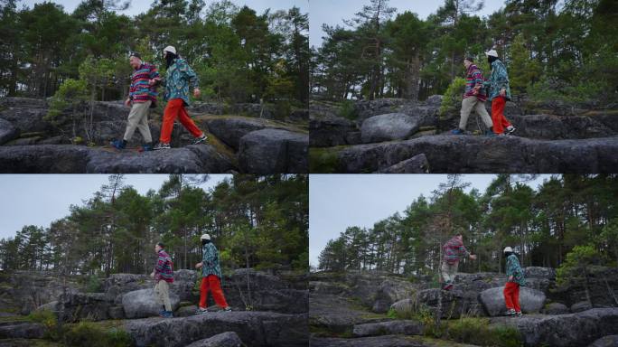 无忧无虑的男女游客一起走在大自然中，旅行在斯堪的纳维亚，慢动作
