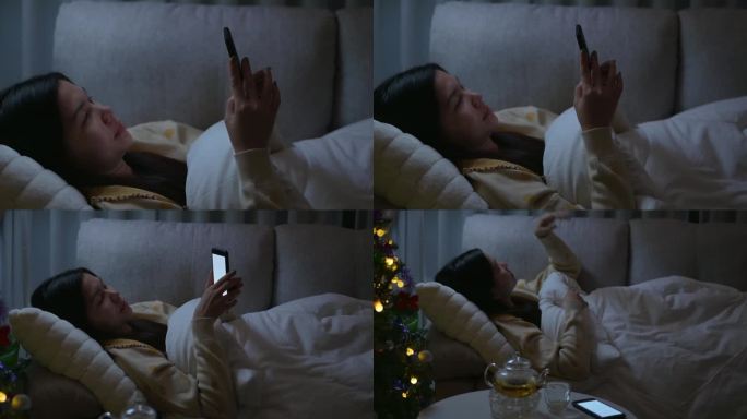 亚洲女性睡觉前会在床上玩智能手机