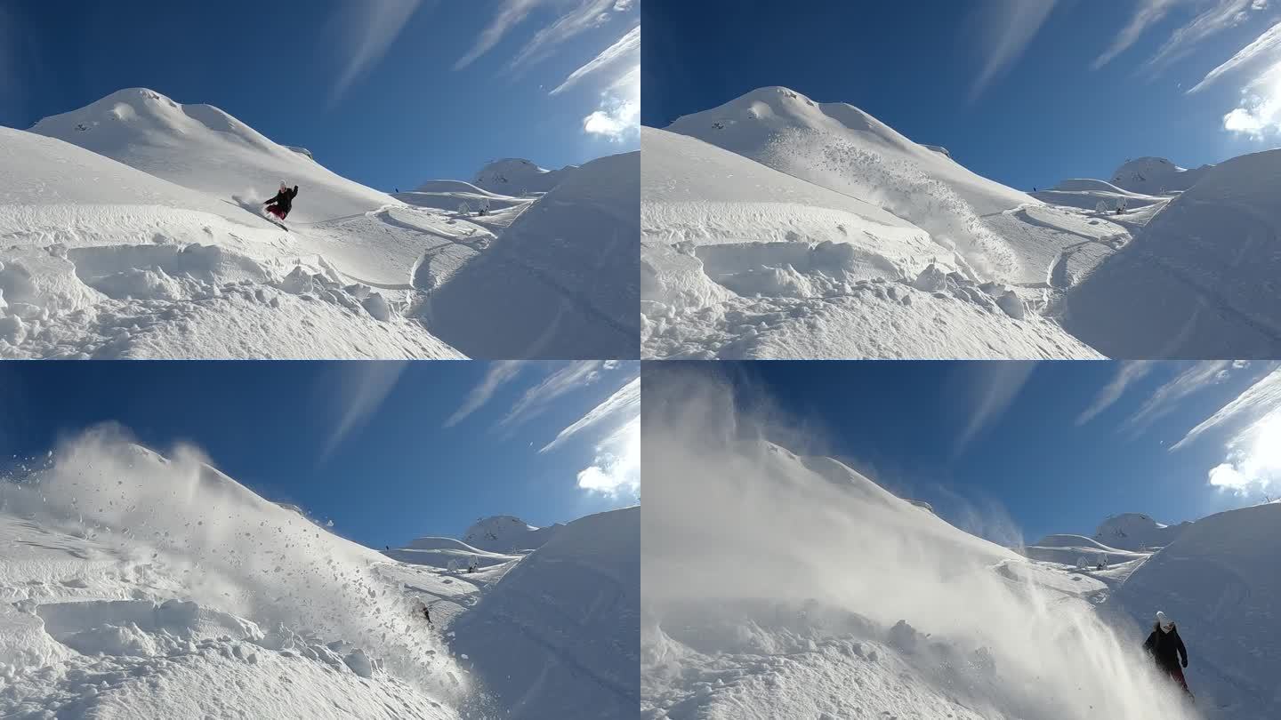 慢镜头:活跃的女士在单板滑雪时喷出大团雪粉