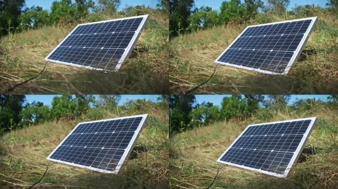 躺在地上的便携式太阳能电池板在大自然户外特写